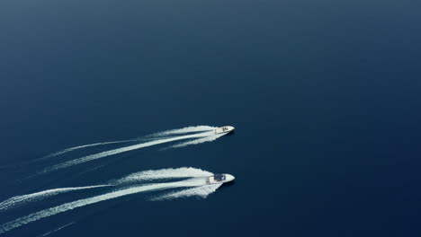 Top-Down-Bird's-Eye-View-of-two-Speed-Boats-Racing