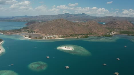 Aerial-of-Lombok-shore-with-traditional-floating-fishermen-instruments-in-bay