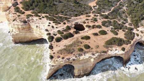 Benagil-Cave,-Atlantic-sea-waves-washing-on-the-cliffs,-Lagoa,-Algarve,-Portugal