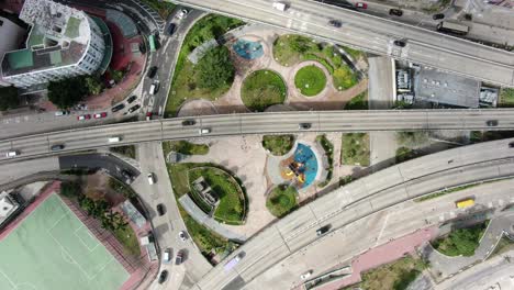 Traffic-on-a-highway-interchange-in-downtown-Hong-Kong,-Aerial-view