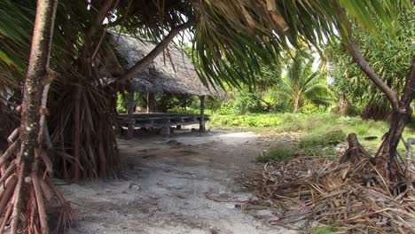 Small-wooden-hut-raised-above-the-ground-on-Fanning-Island,-Republic-of-Kiribati