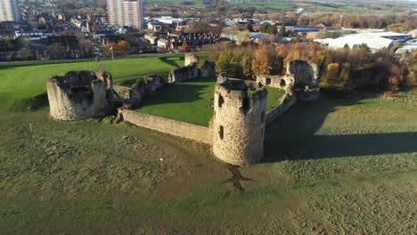 Historical-Flint-castle-medieval-military-ruins-landmark-aerial-view-orbit-right-slow