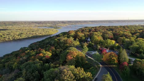 Aerial-push-in-shot-from-the-hills-of-the-Grandview-Drive-in-Peoria-Heights-of-the-Illinois-river-during-the-fall