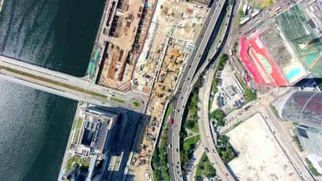 Hong-Kong-downtown-Kowloon-urban-area,-Top-down-aerial-view-with-traffic-and-city-skyscrapers