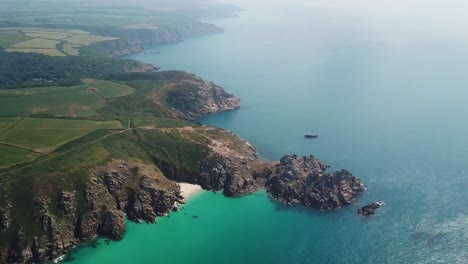 Cornish-coastline-turquoise-sea,-Cornwall-rugged-coves-in-summer,-aerial-view