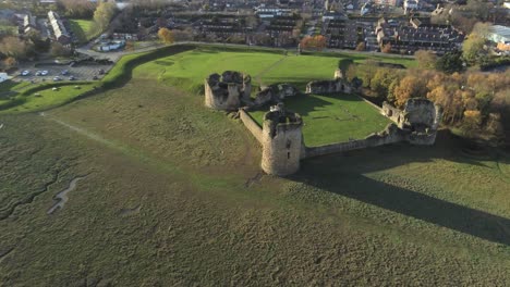 Historical-Flint-castle-medieval-military-ruins-landmark-aerial-view-high-right-orbit