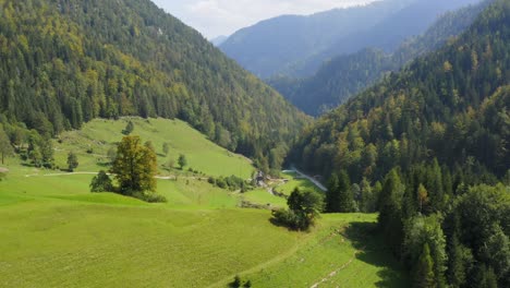 Drone-shot-of-beautiful-Green-mountain-landscape-with-forest-in-Črna-na-Koroškem,-Slovenia