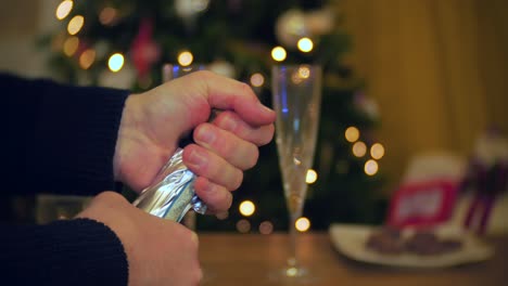 A-bottle-of-champagne-is-opened-at-Christmas