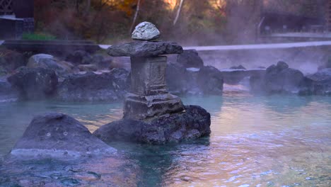 Slow-rising-steam-from-natural-hot-spring-water-in-Kusatsu-Onsen,-Japan