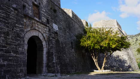 Arched-gate-of-medieval-fortress-with-stone-walls-in-Mediterranean-coast-of-Albania