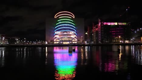 Still-shot-of-Dublin-Convention-Centre-with-vehicles-and-clouds-pass-by-and-night-time