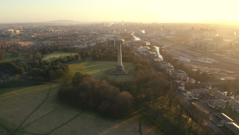 Aerial-view,-The-Wellington-Monument,-or-more-correctly-the-Wellington-Testimonial,-is-an-obelisk-located-in-the-Phoenix-Park,-Dublin,-Ireland