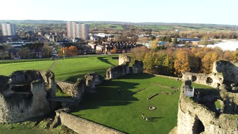 Ancient-Flint-castle-medieval-heritage-military-Welsh-ruins-aerial-view-landmark-close-pull-away-to-right