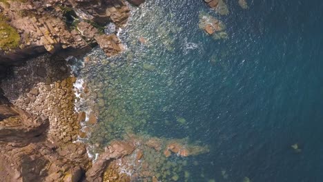 Aerial:-beautiful-rocky-Cornwall-coastline,-UK,-top-down-view
