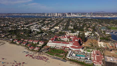 Aerial-View-Of-Hotel-del-Coronado-At-Coronado-Beach-In-San-Diego-On-A-Sunny-Day---drone-shot