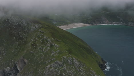 Aerial-view,-flying-over-Moyteoge-Head-and-approaching-Keem-Bay-on-Achill-Island,-beautiful-Irish-landscape-on-the-west-coast-of-Ireland