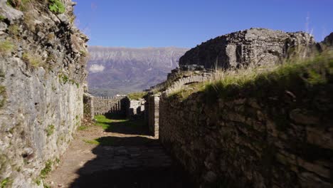 Ruined-stone-walls-of-castle-in-Gjirokaster,-destroyed-by-wars-in-the-Middle-Ages