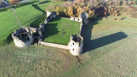 Ancient-Flint-castle-medieval-heritage-military-Welsh-ruins-aerial-view-landmark-descend-tilt-up