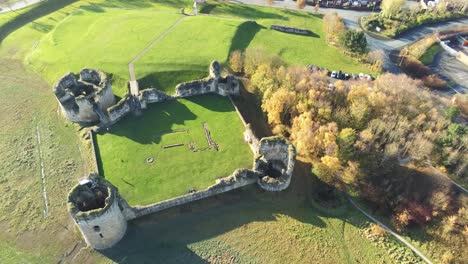 Ancient-Flint-castle-medieval-heritage-military-Welsh-ruins-aerial-view-landmark-pull-back-left-rotate