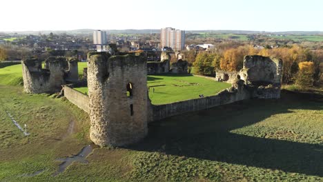 Ancient-Flint-castle-medieval-heritage-military-Welsh-ruins-aerial-view-landmark-mid-orbit-left-shot