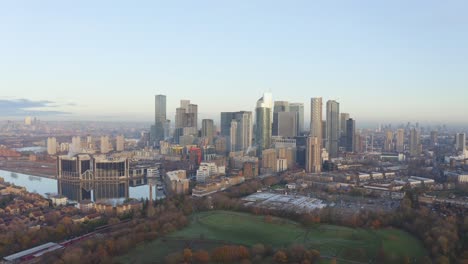 Long-cinematic-circling-left-drone-shot-of-Canary-Wharf-skyscrapers-from-the-South-at-sunrise