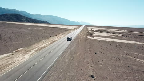Car-Driving-Through-Natural-Desert-Landscape-Of-Death-Valley,-Popular-Tourist-Destination
