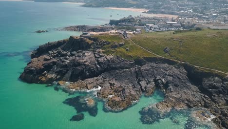 Aerial:-beautiful-Cornwall-coastline,-St-Ives-tourist-destination-town,-UK