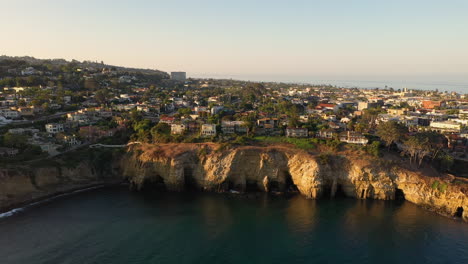 Sea-Caves-At-La-Jolla-Cove-During-Low-Tide---Scenic-Sunset-View-In-California---drone-pullback
