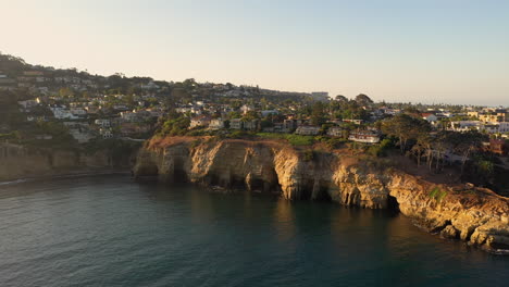 Drone-Shot-Of-Coastal-Caves-At-La-Jolla-Cove-In-California-On-A-Gorgeous-Sunset---aerial