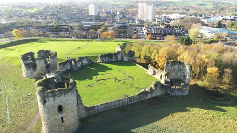 Ancient-Flint-castle-medieval-heritage-military-Welsh-ruins-aerial-view-landmark-tracking-descent