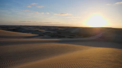 Tilting-up-shot,-Scenic-view-of-Desert-sand-in-Adolfo-Lopez-Mateos-Baja-California-sur,-Mexico,-Sun-rise-in-the-background