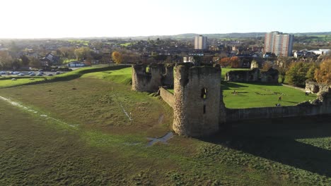 Ancient-Flint-castle-medieval-heritage-military-Welsh-ruins-aerial-view-landmark-skyline-orbit-right