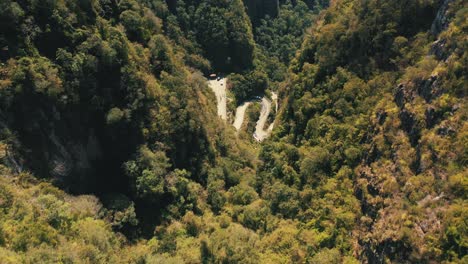 Aerial-view-top-down-view-of-tropical-rainforest-mountain-road,-Serra-Do-Corvo-Branco,-Grão-Pará,-Santa-Catarina,-Brazil