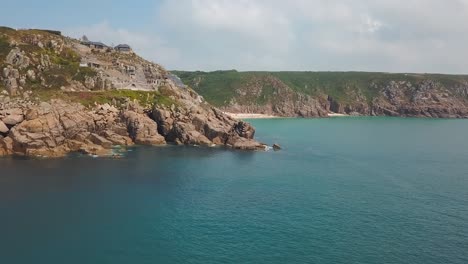 Aerial:-amazing-Cornwall-coast-and-Minack-Theatre-on-Porthcurno-clifftop