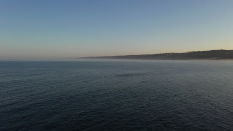 Wide-Angle-Shot-Of-Rippling-Ocean-Under-Blue-Sky-In-La-Jolla-Cove,-California---aerial