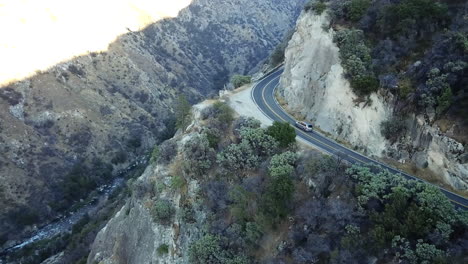 Aerial-Shot-Of-Cars-Driving-Winding-Road-In-Sequoia-National-Park-In-California,-USA