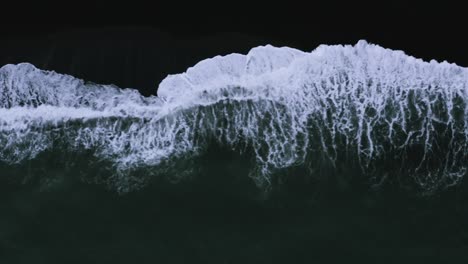 Atlantic-Ocean-Waves-Swashing-At-The-Coast---aerial-top-view,-sideway-shot