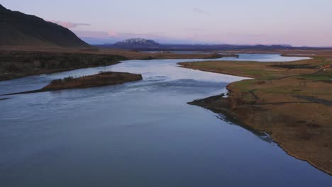 Calm-Water-Of-Olfusa-River-Running-Along-Icelandic-Fields-Near-Selfoss,-Southern-Iceland