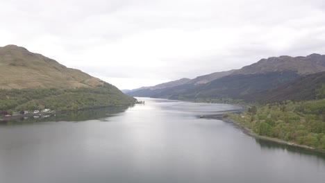 Aerial-over-calm-Loch-Lomond-with-mountains-on-either-side