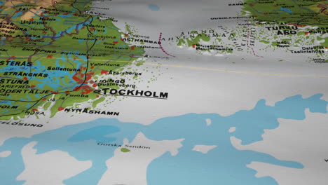 Tracking-shot-showing-Stockholm-and-surrounding-area-on-paper-map