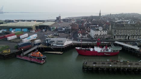 RLNI-lifeboat-and-Historic-light-ship,-the-LV-18-moored-at-Harwich-quay-side-drone-footage