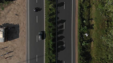 Top-down-shot-of-highway-in-India-where-more-and-more-of-the-road-is-revealed-as-the-drone-flies-up