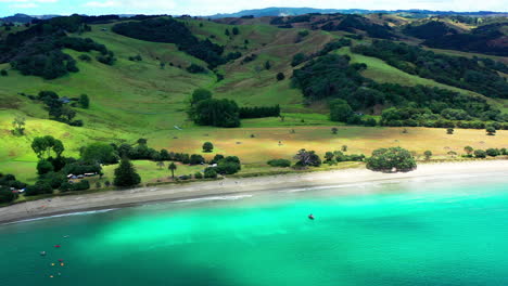 Te-Muri-Beach-Camping-Ground-During-Summer-With-Green-Mountains-In-New-Zealand