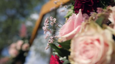 boho-decorated-hexagonal-outdoor-wedding-ceremony-arch-detail,-defocus-closeup