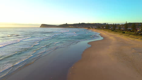 Cinematic-rising-drone-shot-into-the-sun-at-Lennox-Head-Beach-near-Bryon-Bay