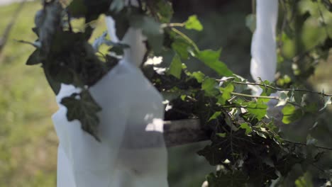 wedding-decoration-swing-moving-on-windy-day,-slow-motion-detail-shot,-sunny-day