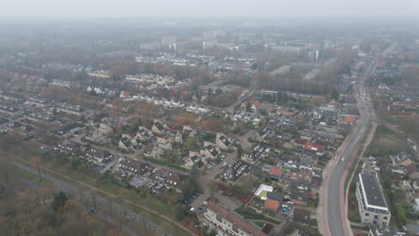 High-jib-up-of-small-town-in-the-Netherlands-with-fog-in-the-background