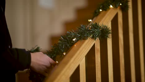 Christmas-Lights---Garland-on-Staircase-Railing-Banister,-Closeup