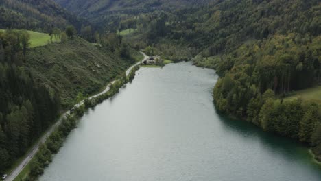 South-shore-of-Freibach-reservoir-in-Austria-artificial-dam,-Aerial-dolly-out-reveal-shot
