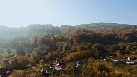 Aerial-footage-of-autumn-landscape-in-a-village-from-Romania,-Europe